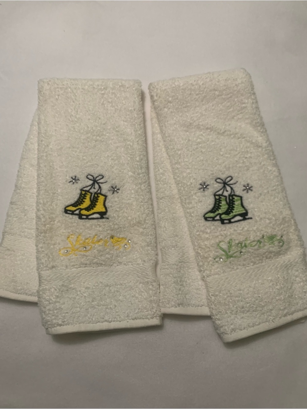 Mystique Boutique White Hand Towels With  Embroidered Ice Skates Yellow & Green